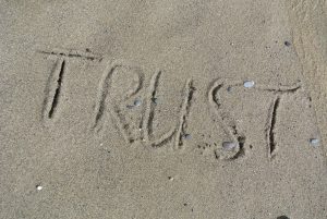 trust, written in sand